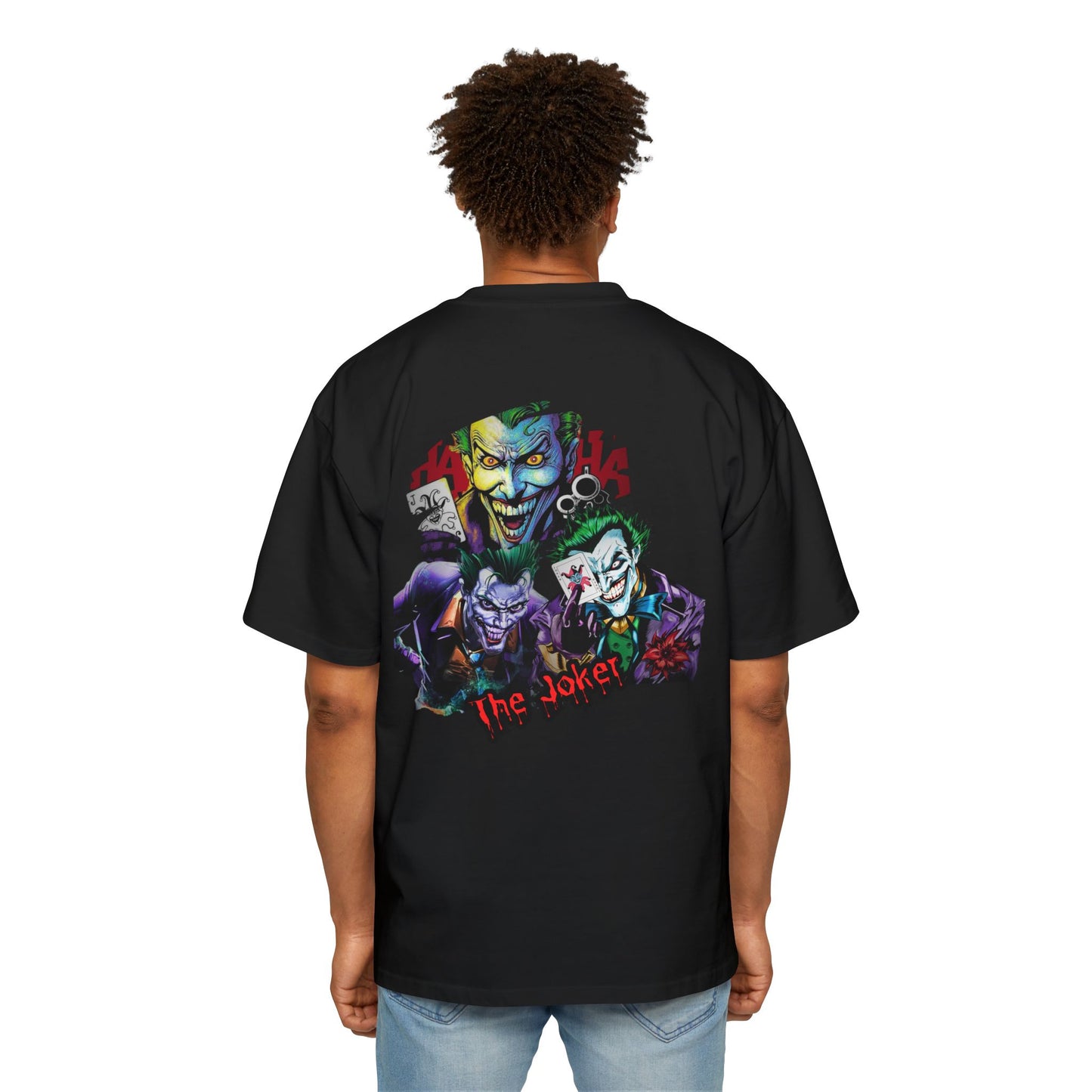 Person wearing a black t-shirt with 'The Joker' graphic design on the back.