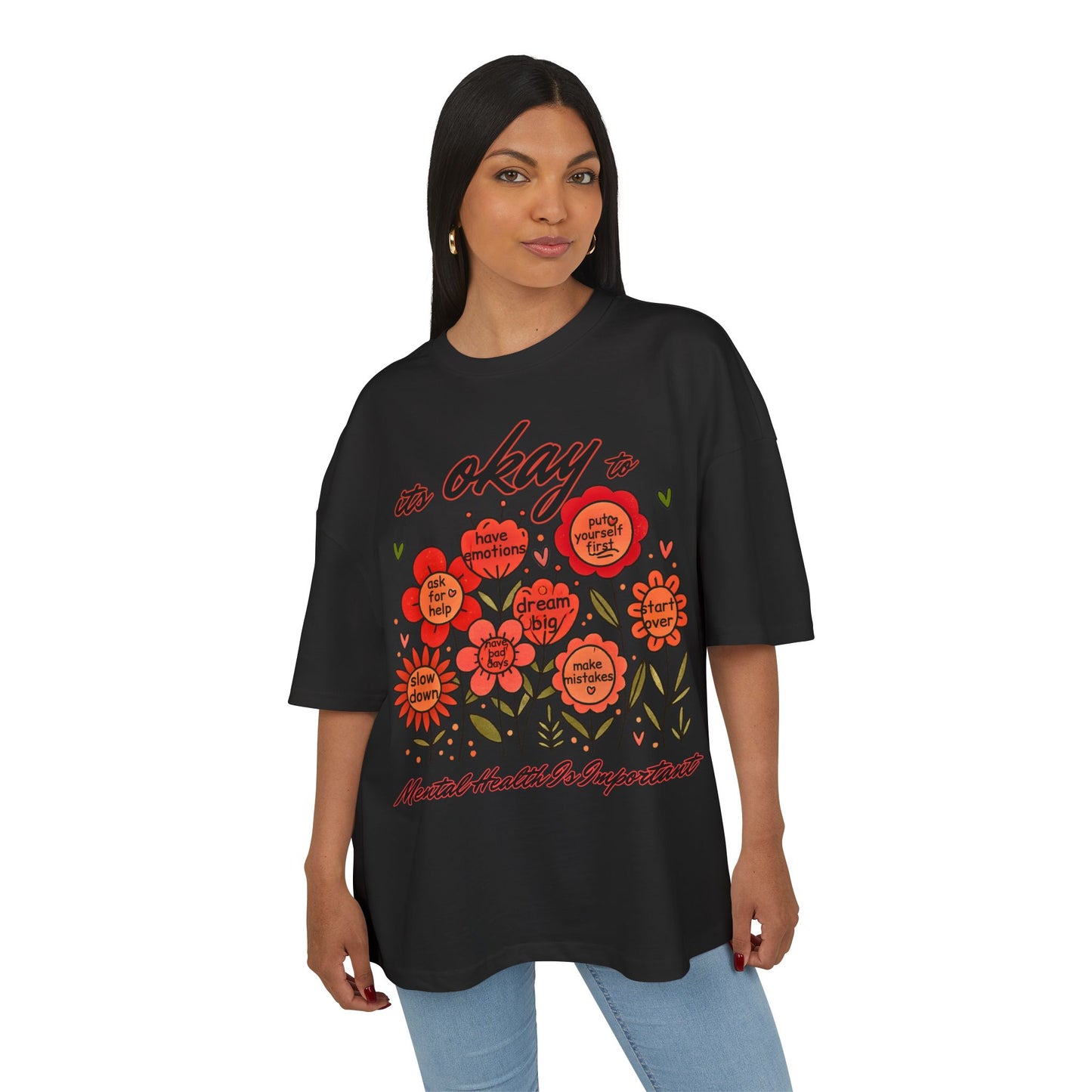 Woman wearing a black t-shirt with colorful graphics and text on a white background