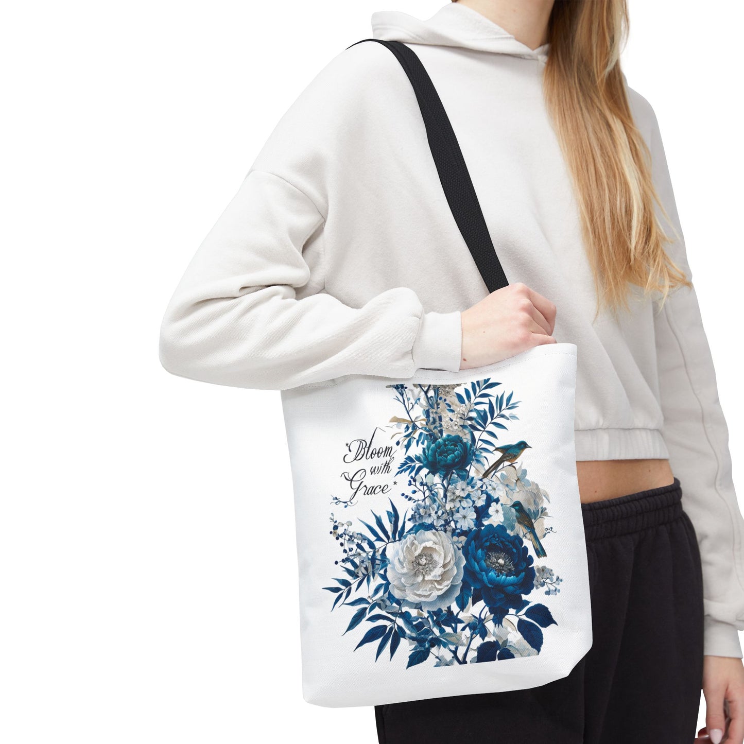 Tote Bag With a botanical blue flower design with the word Bloom with Grace written on it