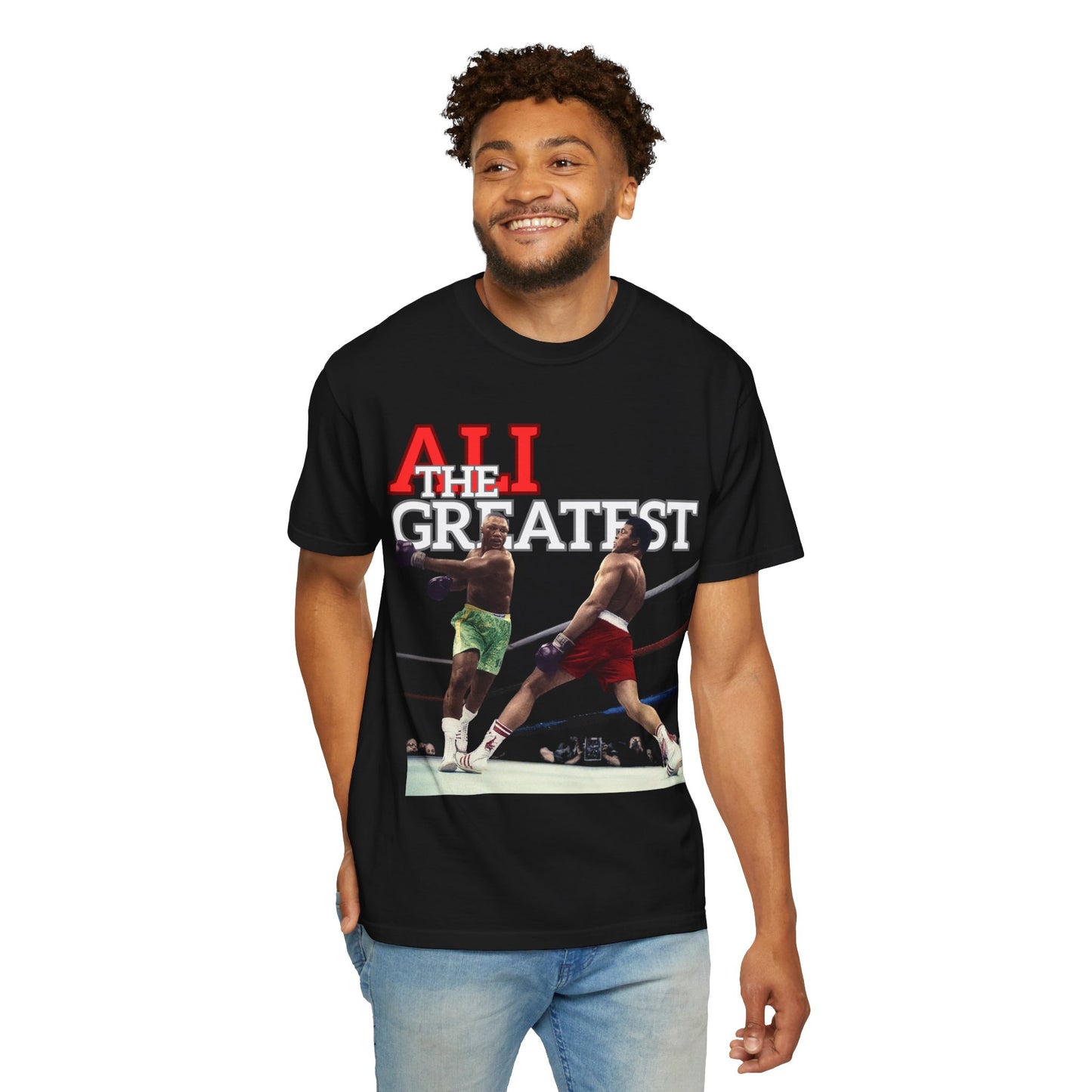 man wearing a black t-shirt of Muhammad Ali graphic and 'Ali The Greatest' text on a white background