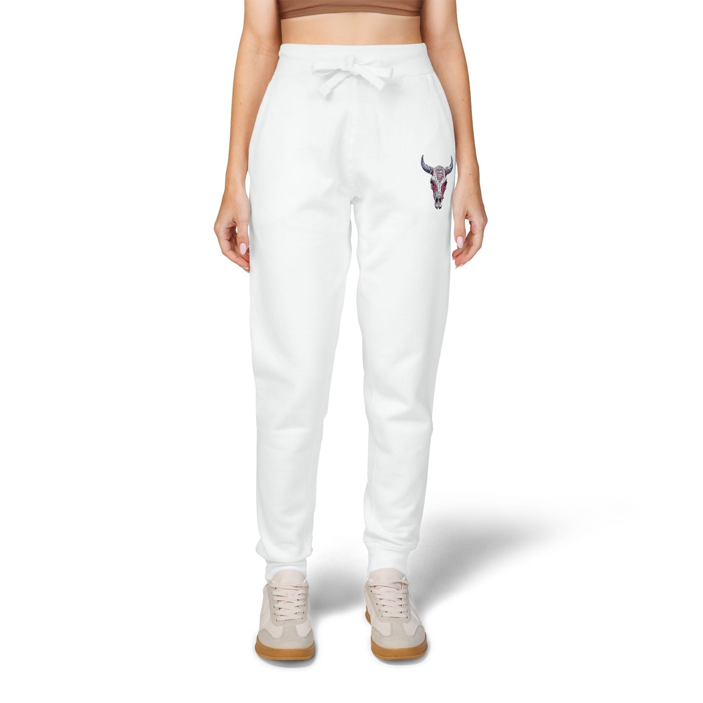 woman wearing White women's jogger pants with a small graphic on a white background