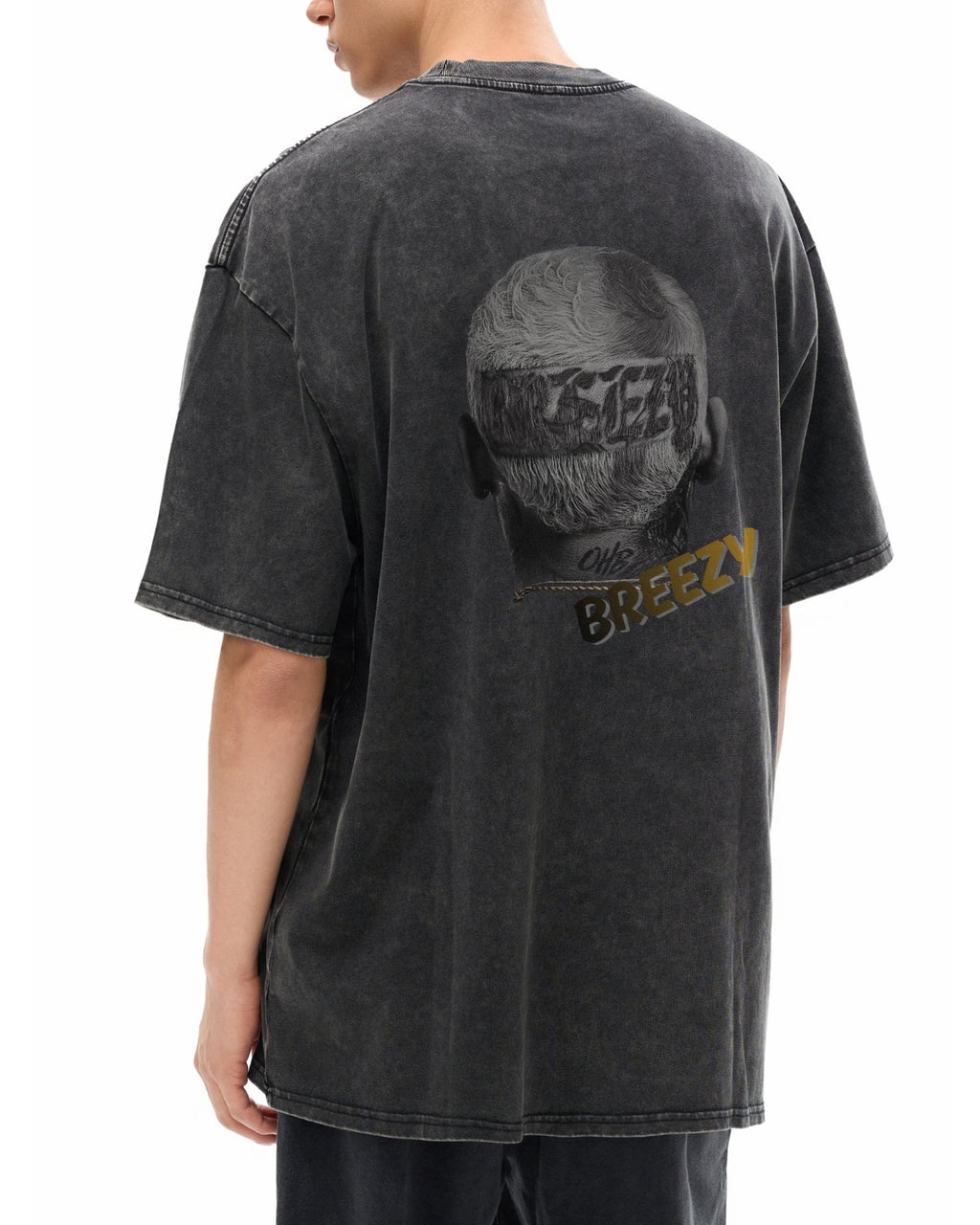 Person wearing a black t-shirt with a graphic design on the back, featuring text and a silhouette