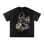 Black snow-washed oversized T-shirt featuring a Taylor Swift performance collage with microphones, guitars, gold accents and Taylor signature lettering.