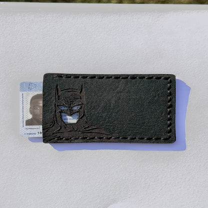 A black hand crafted batman id wallet with cut-out holes
