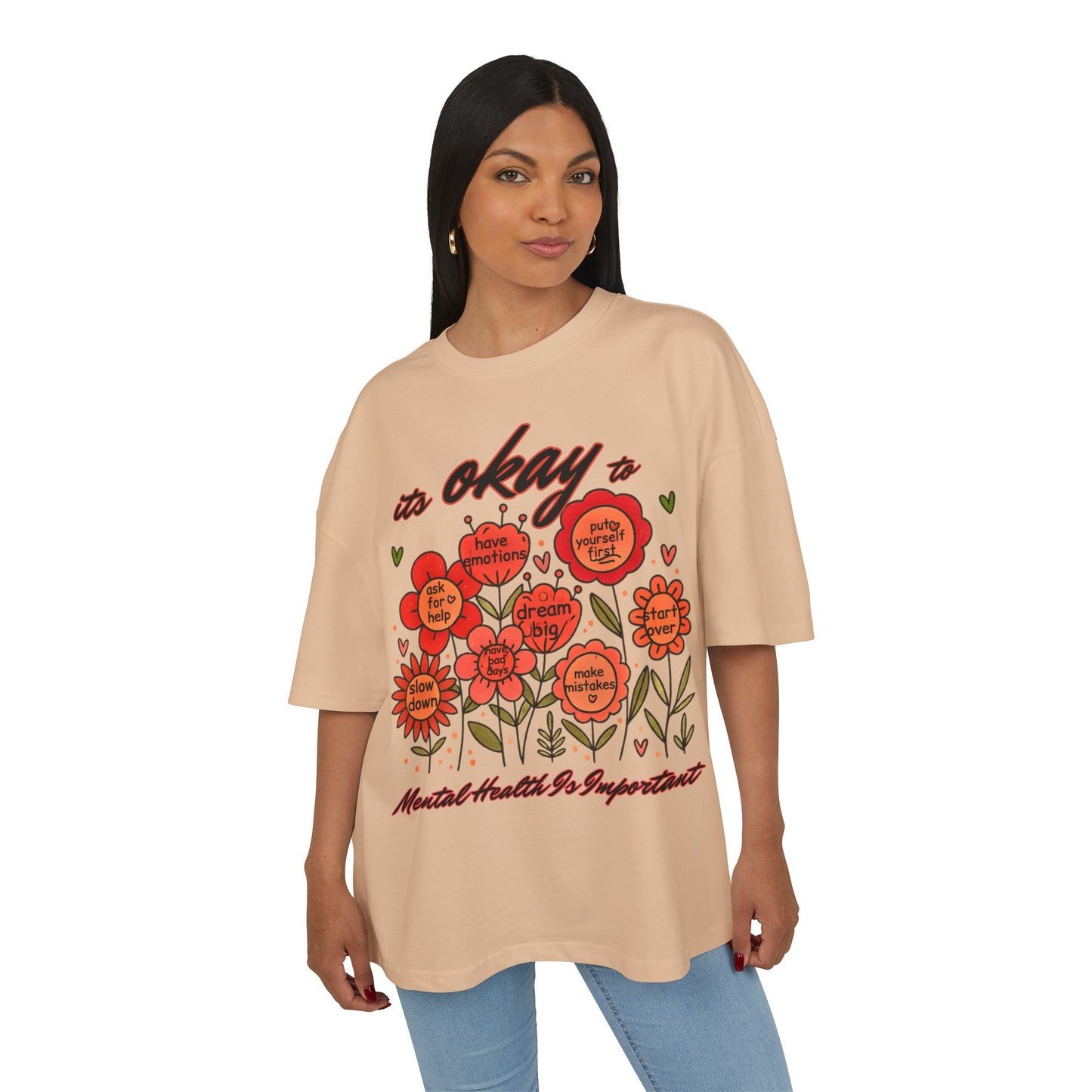 Woman wearing a beige t-shirt with floral design and text on a white background