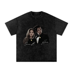 Washed-black oversized Beyoncé and Jay-Z T-shirt featuring Queen B and Hova in formal black outfits with white script.