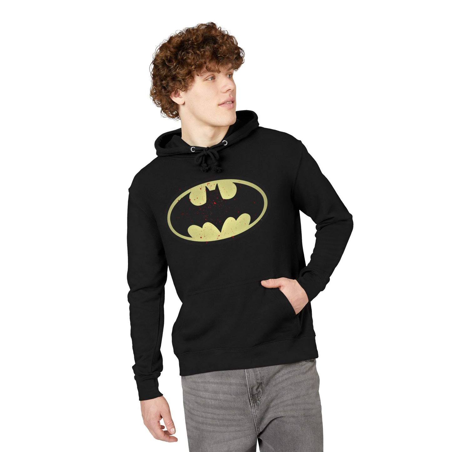 Person wearing a black hoodie with a Batman logo on a white background