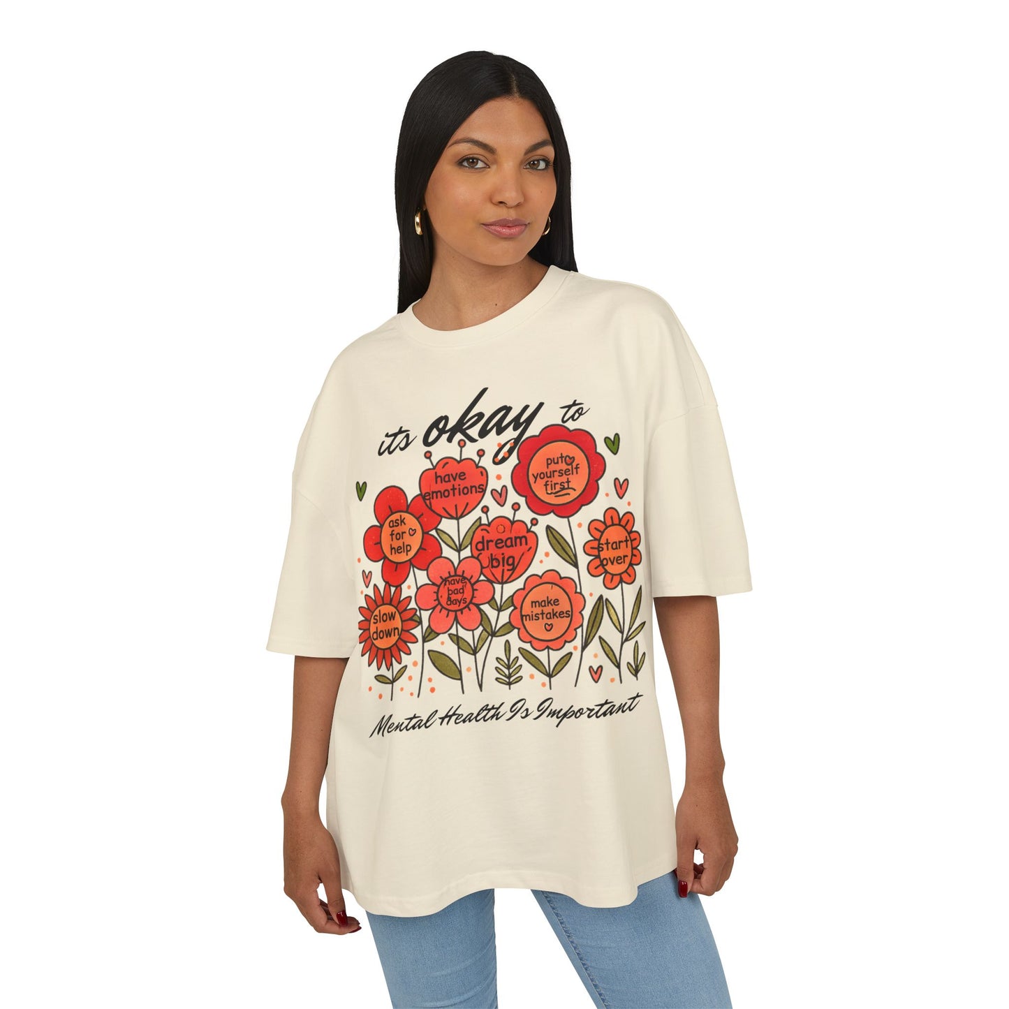 Woman wearing a cream t-shirt with floral design and text on a white background