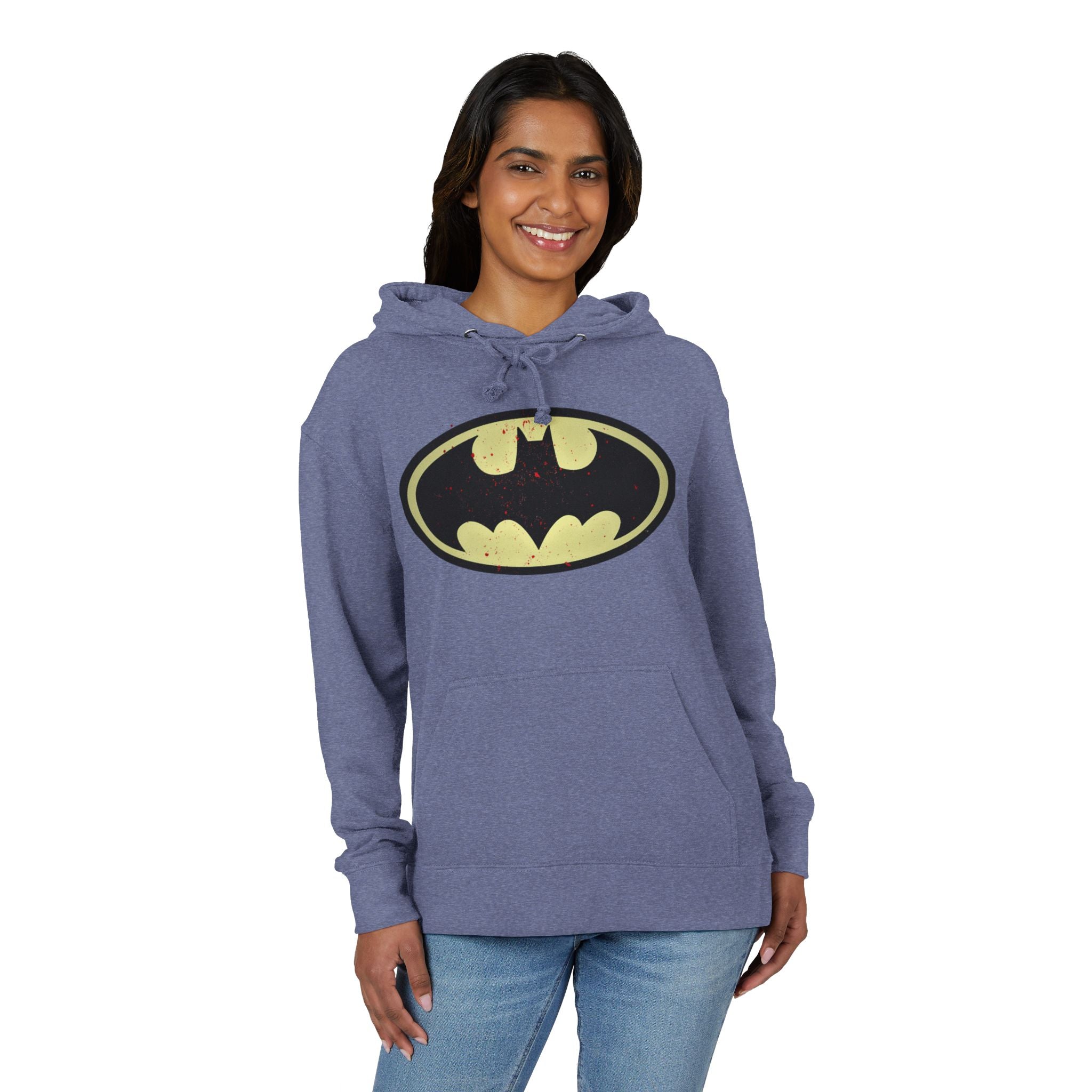 Woman wearing a heather denim hoodie with a Batman logo on a white background