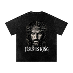 Back of black snow washed Jesus Is King graphic tee with Jesus crown of thorns portrait and distressed white lettering