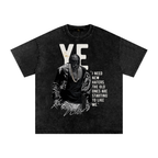 Washed-black oversized Kanye West T-shirt featuring Ye in a black mask, large white YE lettering and a bold quote graphic.