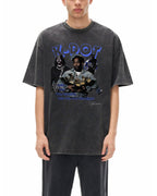 Person wearing a black t-shirt with graphic design of kdot on a white background
