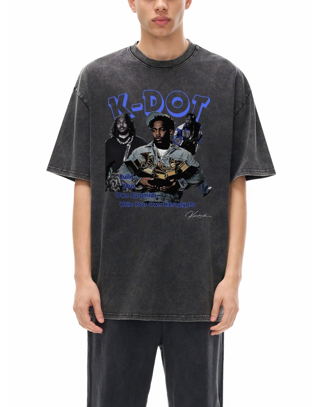 Person wearing a black t-shirt with graphic design of kdot on a white background