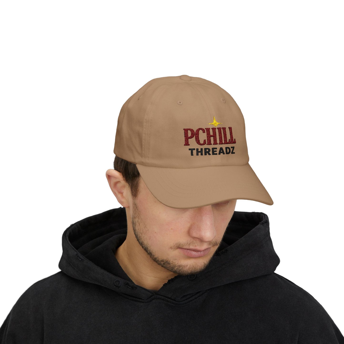 Man wearing a khaki cap with 'PCHILL THREADZ' logo on a white background