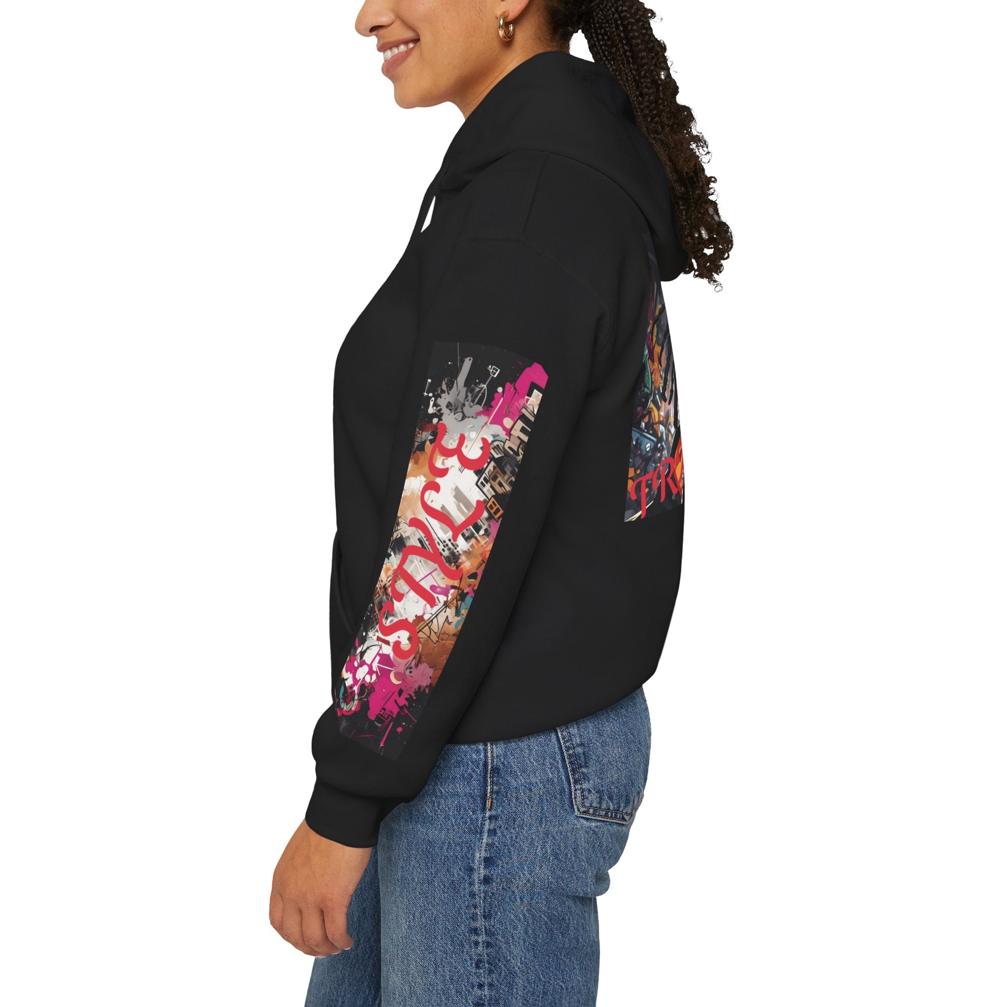 left sleeve of woman wearing a black graphic hoodie with colorful graphics and text style