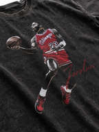 Close up Michael Jordan 23 dunking graphic printed on black snow washed t-shirt fabric with red uniform and Jordan signature