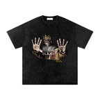 Washed-black oversized Notorious B.I.G. T-shirt featuring Biggie Smalls wearing a gold crown with both hands raised.