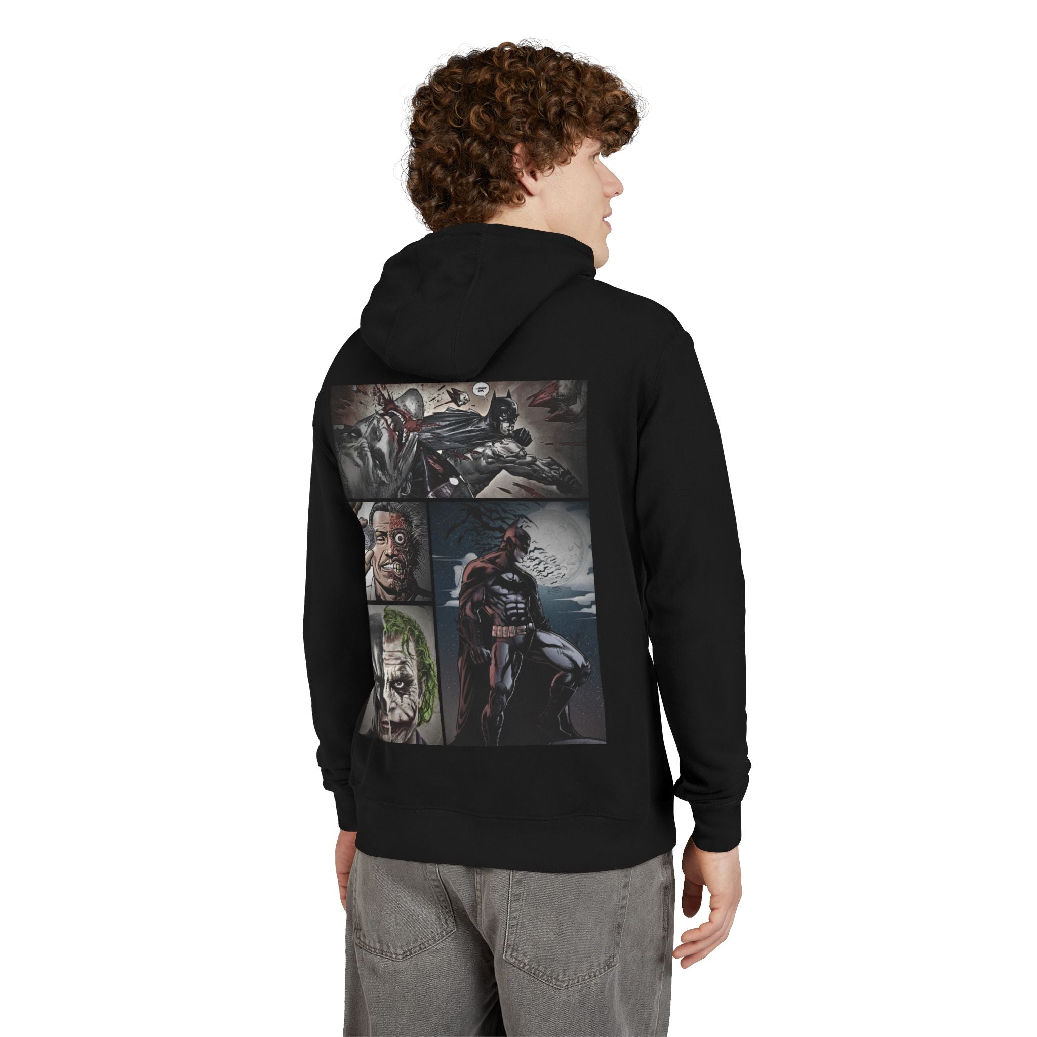 Person wearing a black hoodie with batman graphic designs on the back, standing against a white background