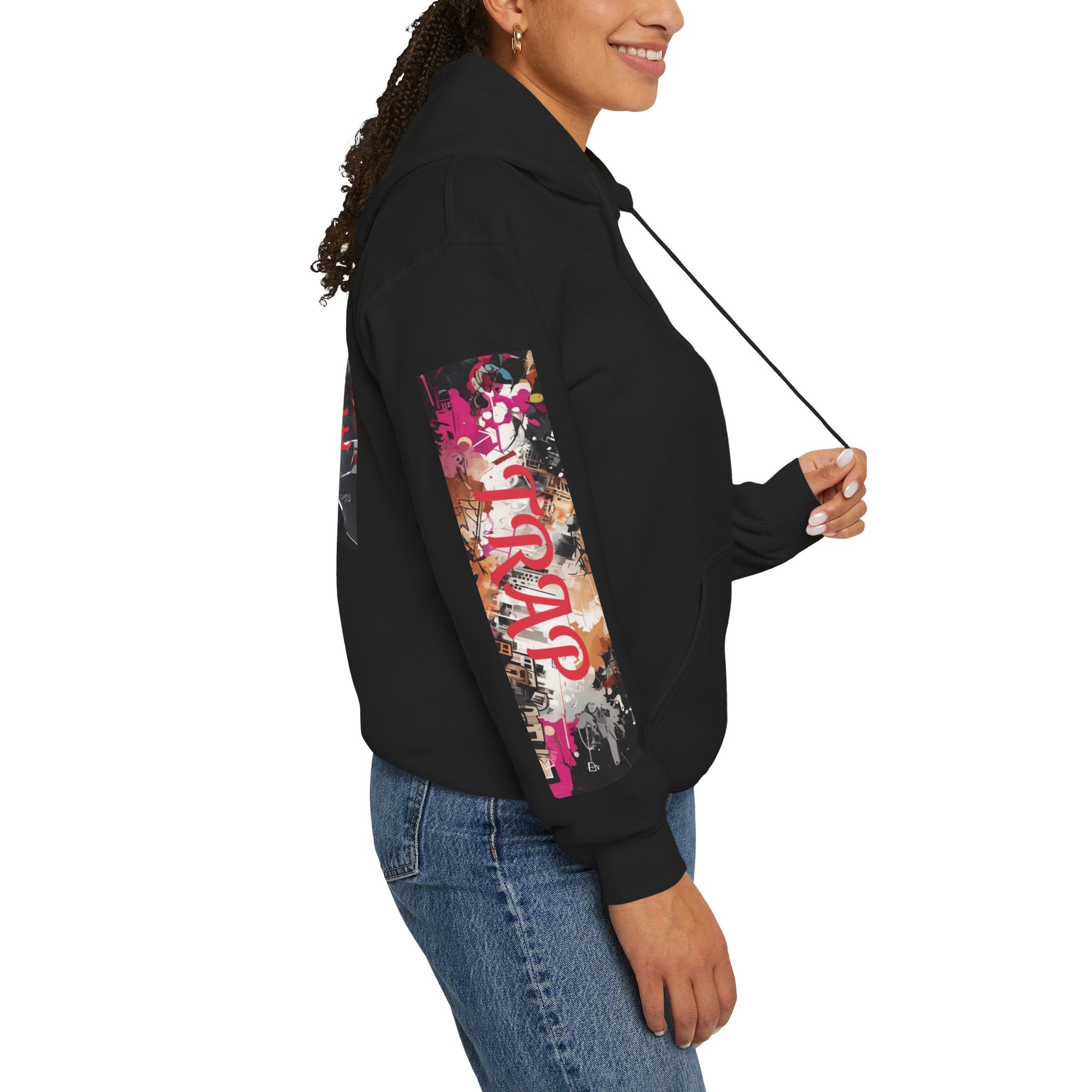 right sleeve of woman wearing a black hoodie graphic with colorful graphics and text trap
