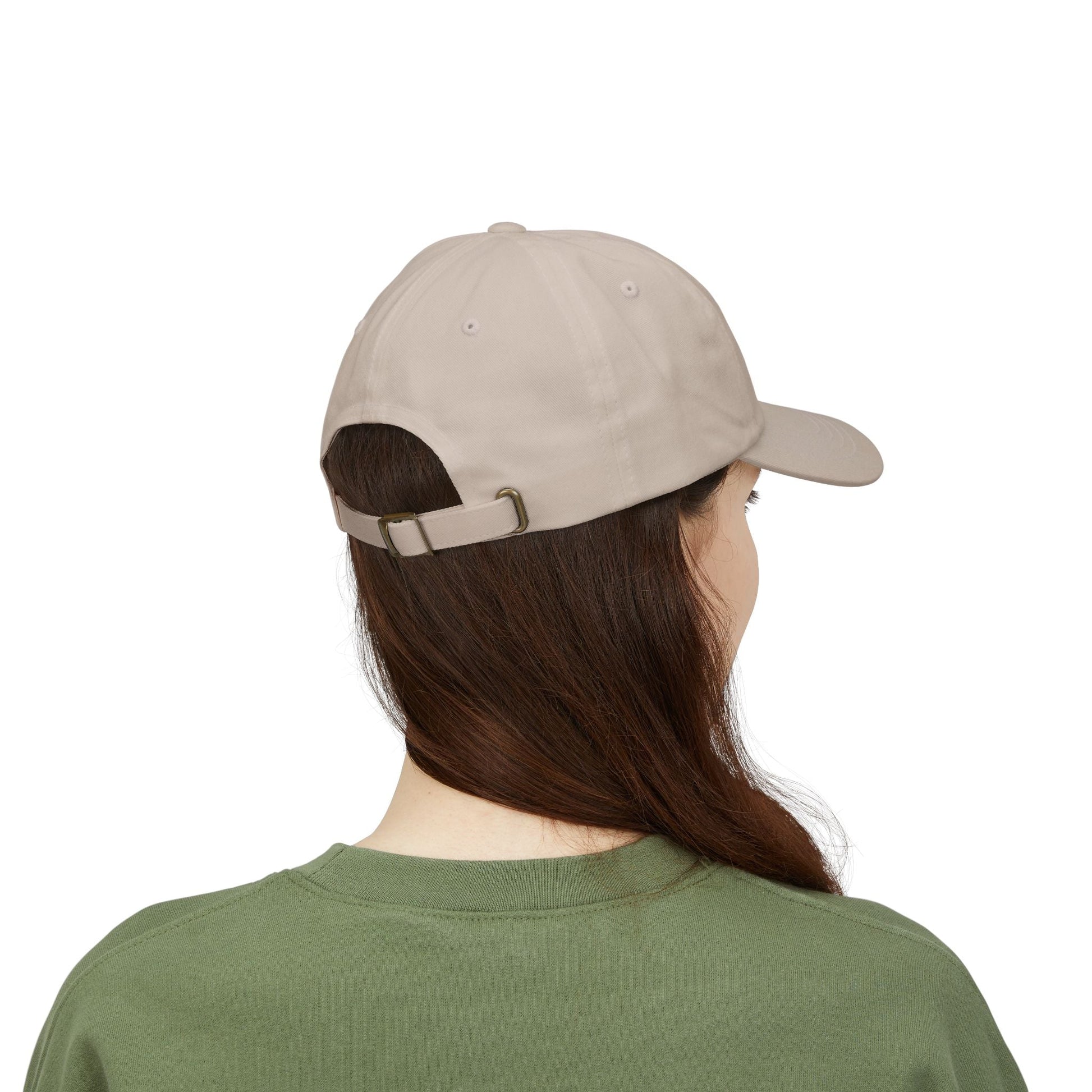 back of Person wearing a sand stone cap and green shirt on a white background