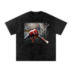 Black t-shirt with graphic design of a red superhero character holding a baseball bat on a white background
