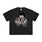 Tom Brady with his championship rings on a black tshirt in a white background