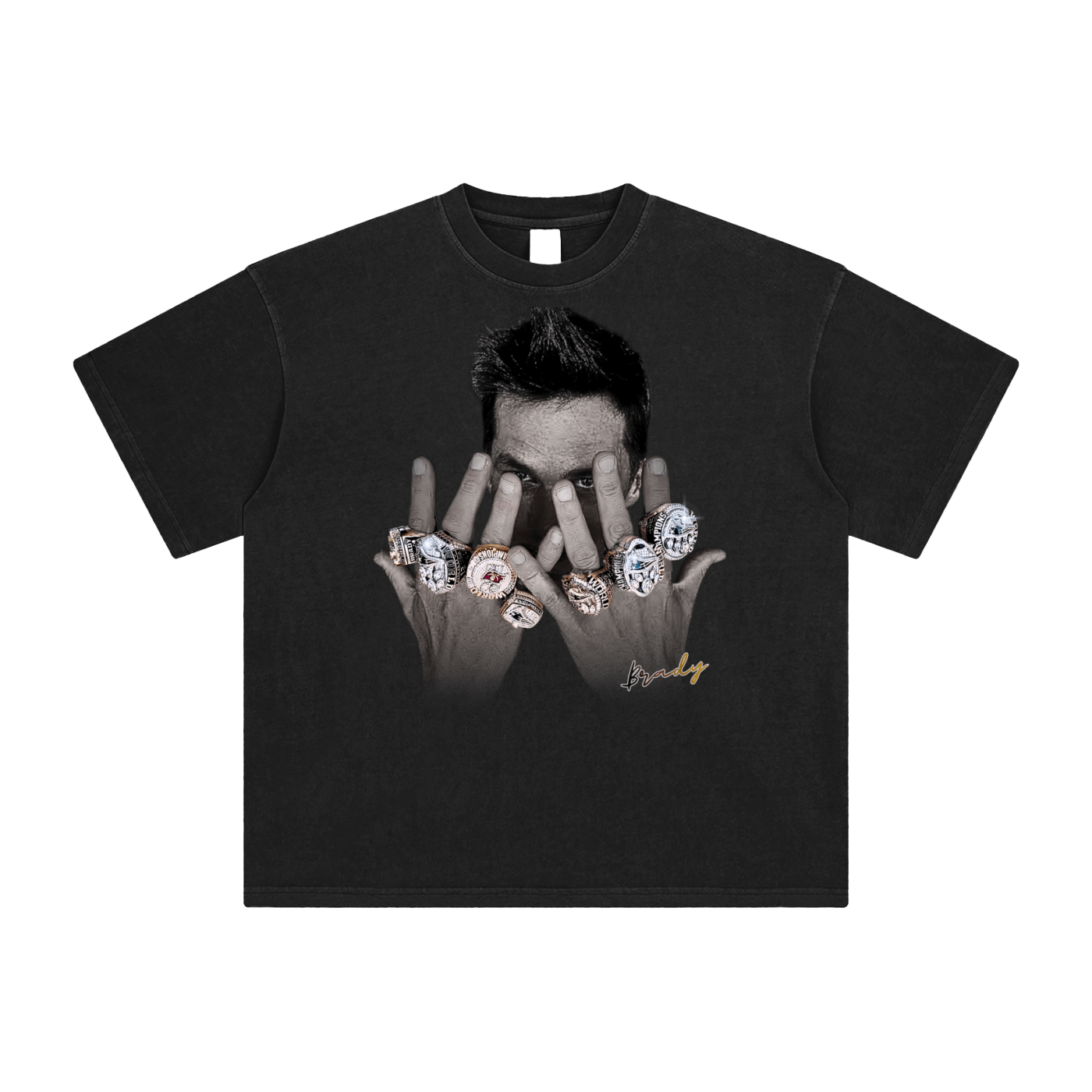 Tom Brady with his championship rings on a black tshirt in a white background