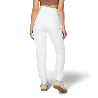 back view of woman wearing white jogger pants on a white background