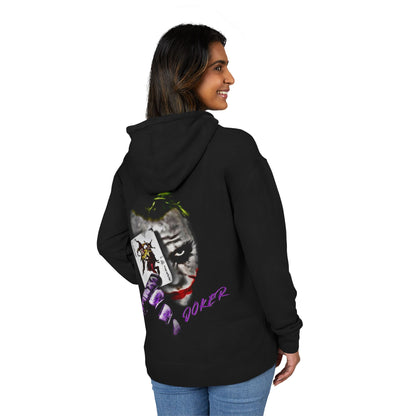 woman wearing a black hoodie with a joker graphic design on the back, standing against a white background
