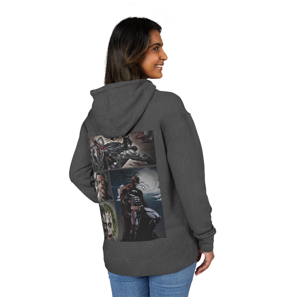 woman wearing a gray hoodie with a batman graphic design on the back, standing against a white background