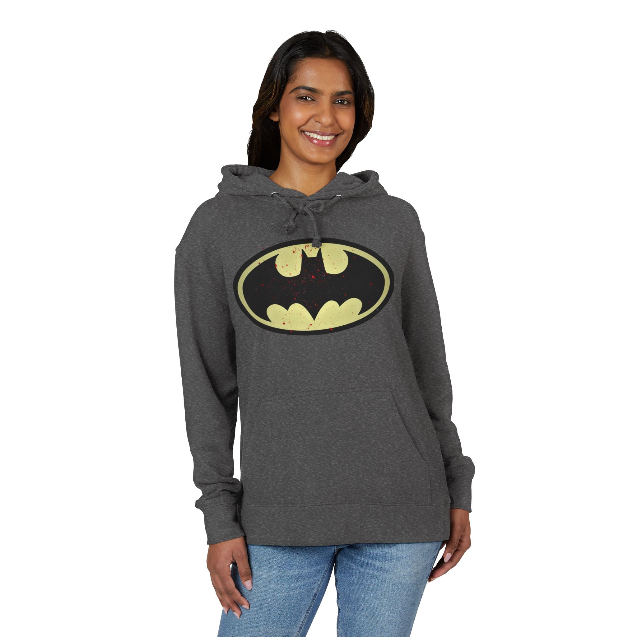 Woman wearing a gray hoodie with a Batman logo on a white background